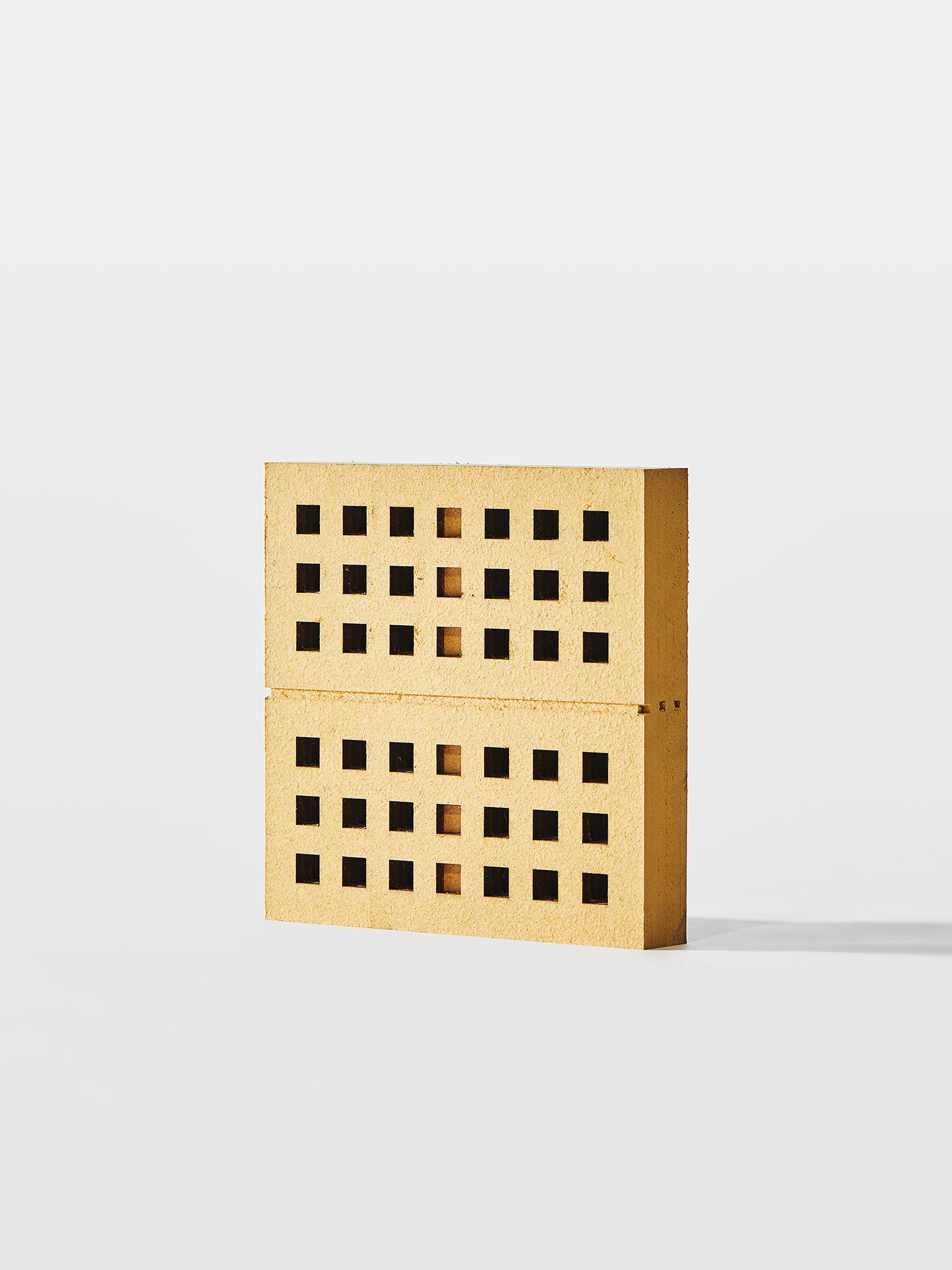 Camille Blin<br><br>This stool is an evocation of the robustness of the material, with a direct reference to building bricks. Different properties fuel this comparison: the stool’s construction principle is based on stacking rectangular base elements, both masonry bricks and sponge brick are hollowed out and present a similar thickness (when the sponge plate is expanded). This design is also a demonstration of the resistance of the dried material, the user is sitting on a brick column. The stool is primarily an exploration of a visual approach to the material, shifting the focus from a purely technically driven one.